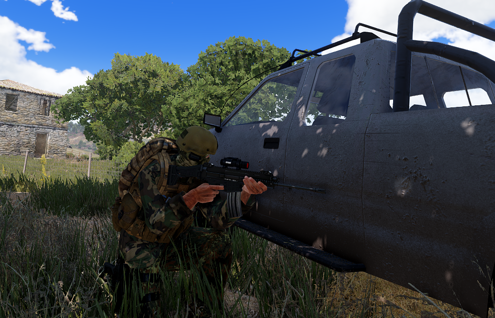 GFLA fighter taking cover beside a vehicle