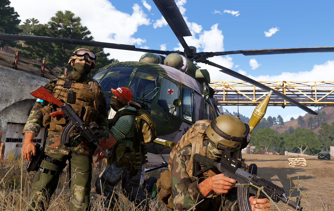 GFLA fighters gathered beside a helicopter