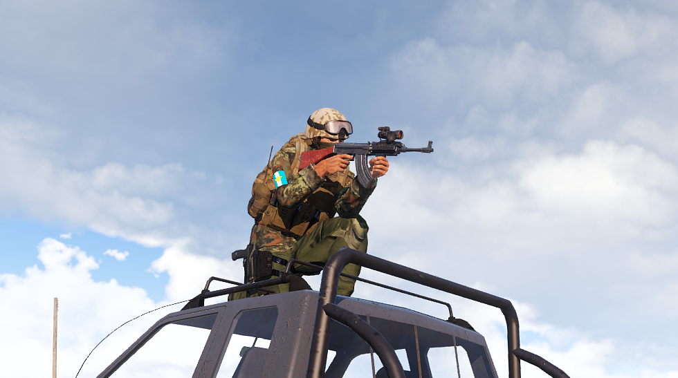GFLA fighter aiming from the roof of a vehicle