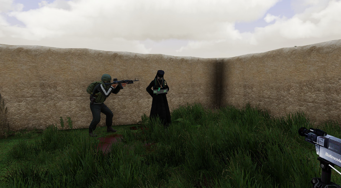 GFLAF fighters filming a captured priest wearing an explosive vest in a fictional Arma scene