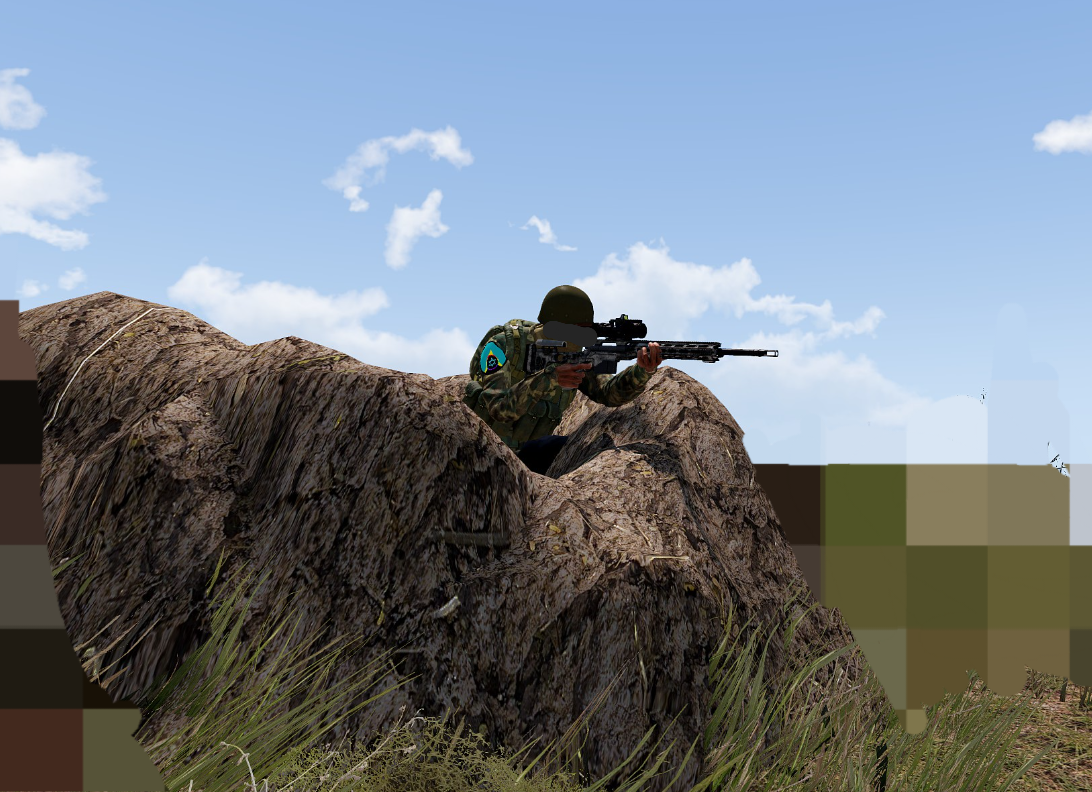 NQF fighter positioned on rocks with a rifle