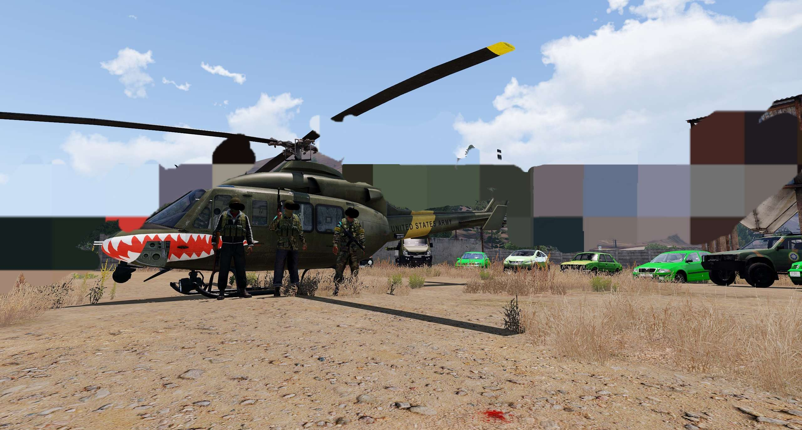 NQF fighters posing near a captured helicopter and vehicles