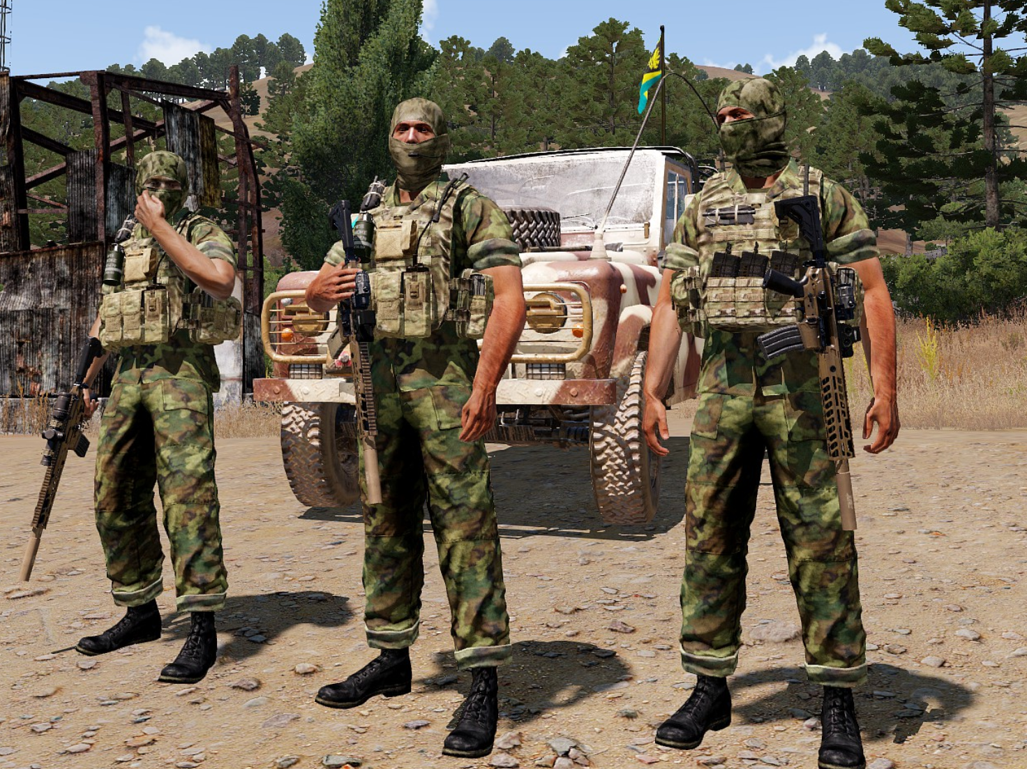 Three NQF fighters standing beside a field vehicle