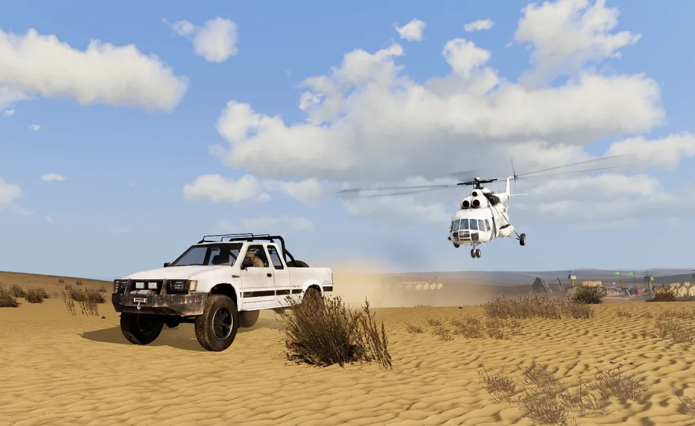 UN-marked vehicle and helicopter crossing the desert