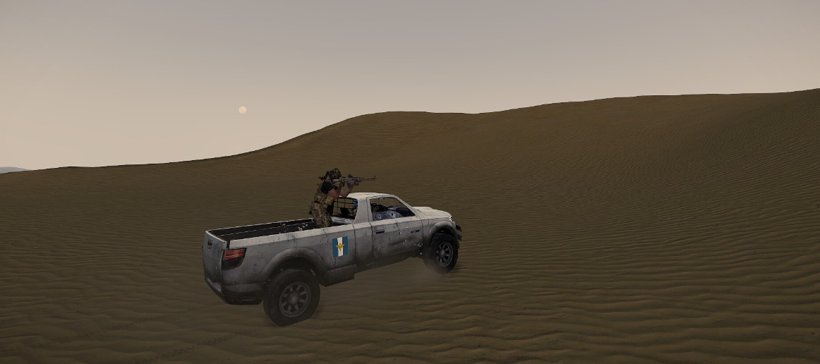 UN patrol vehicle driving through dunes at dusk
